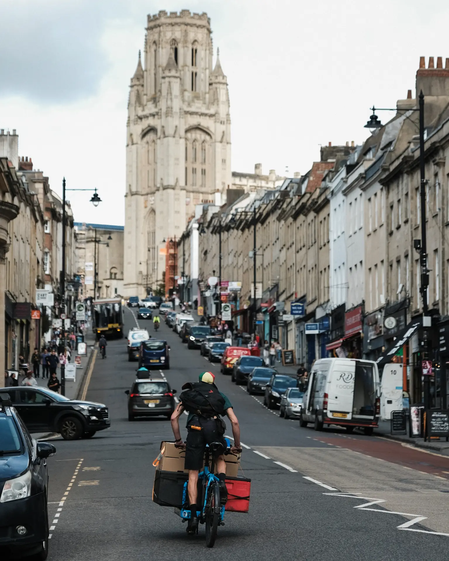 Electric cargo bike making a sustainable same-day delivery on a UK city street