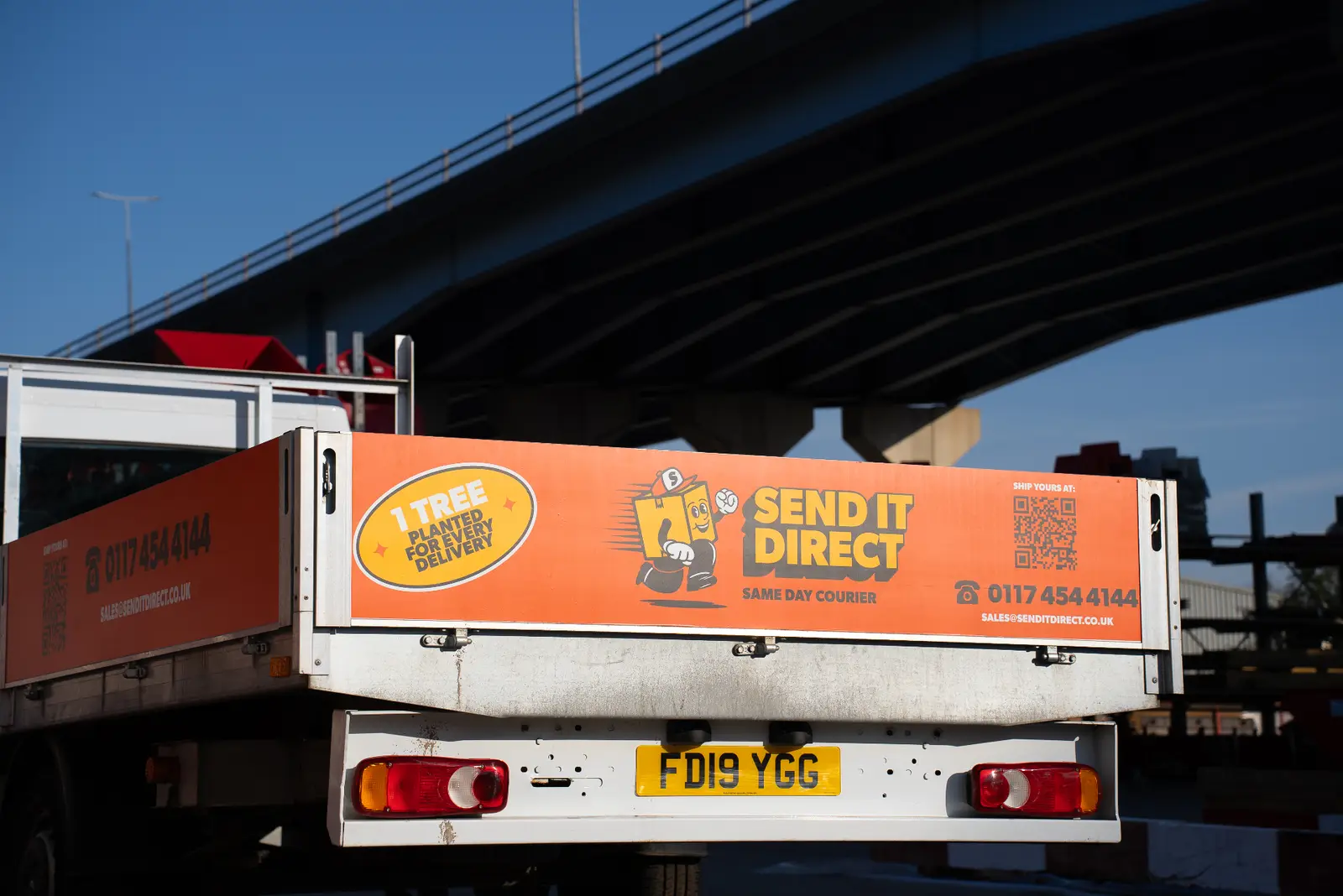 Send It Direct flatbed truck with branding