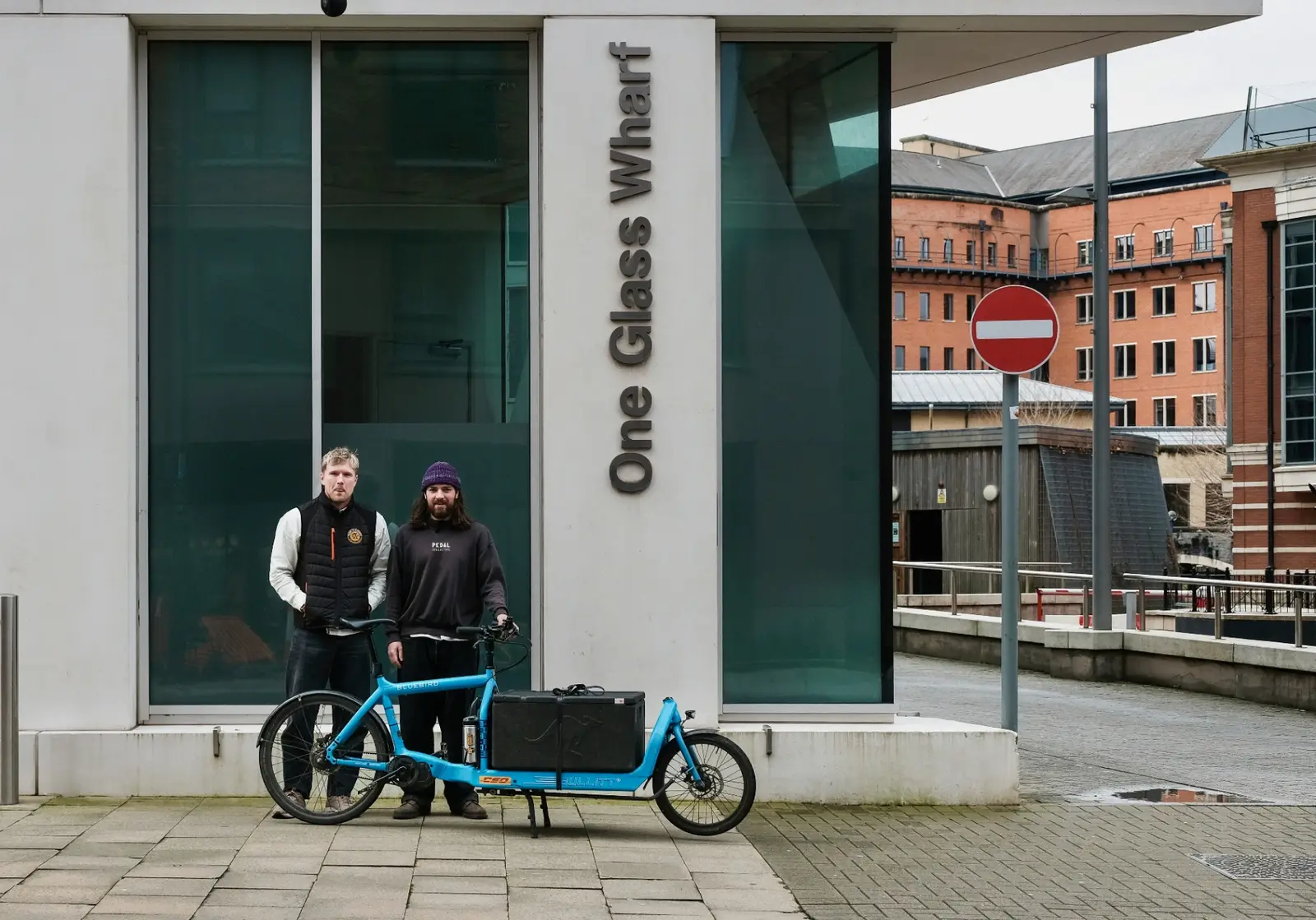 Send It Direct and Pedal Collective team with cargo bike outside One Glass Wharf, Bristol