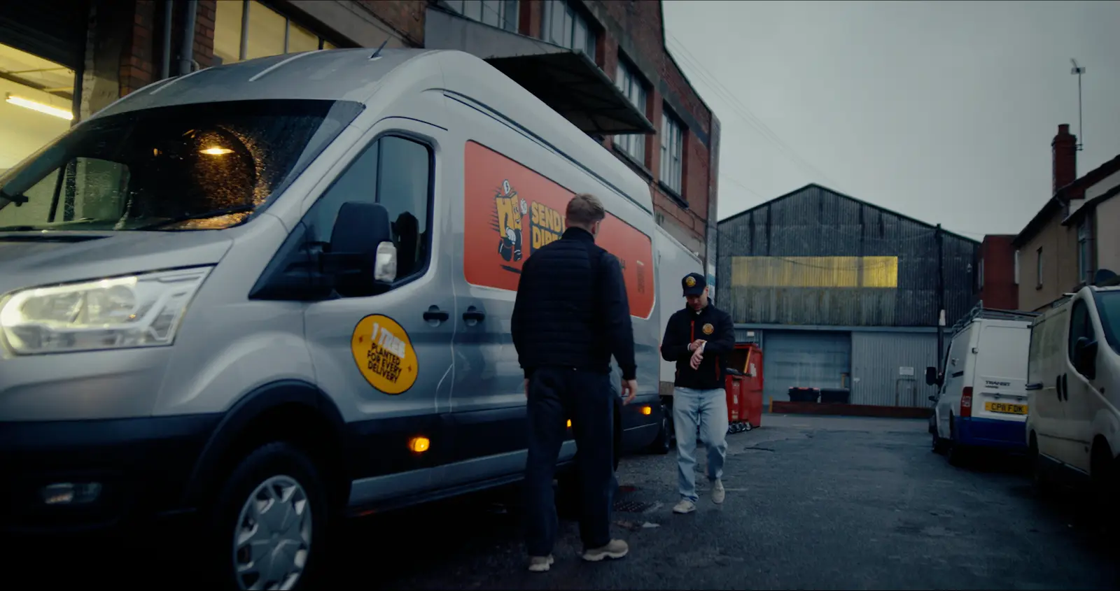 Send It Direct team beside a liveried courier van at dispatch
