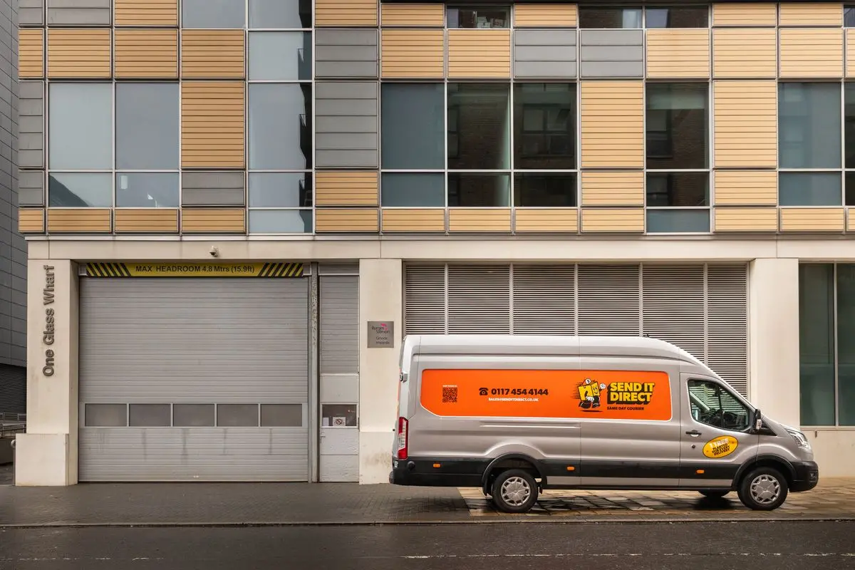 Send It Direct same-day courier van on a UK road — carbon-neutral delivery